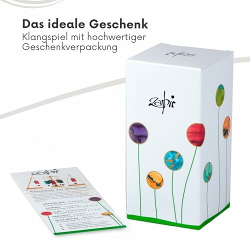 Geschenkverpackung für Klangspiel mit Blumenmuster.