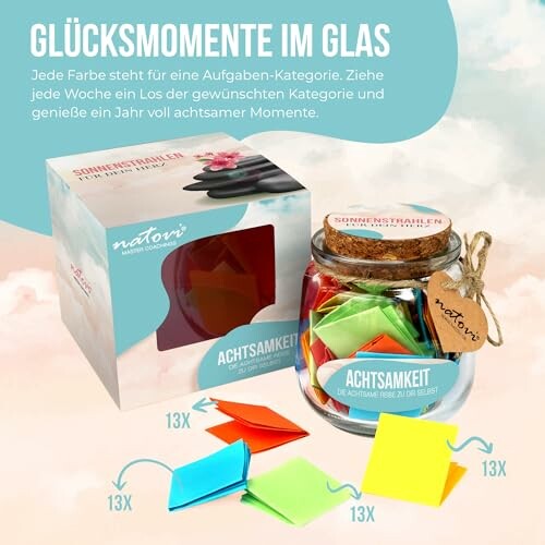 Ein Glas mit bunten Zetteln und einer Verpackung mit der Aufschrift 'Achtsamkeit'.