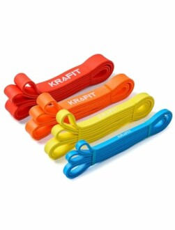 Mehrfarbige Widerstandsbänder von Kraftfit gestapelt.