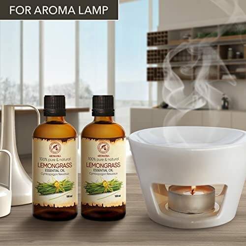 Zitronengras-Ölflaschen neben einer Duftlampe