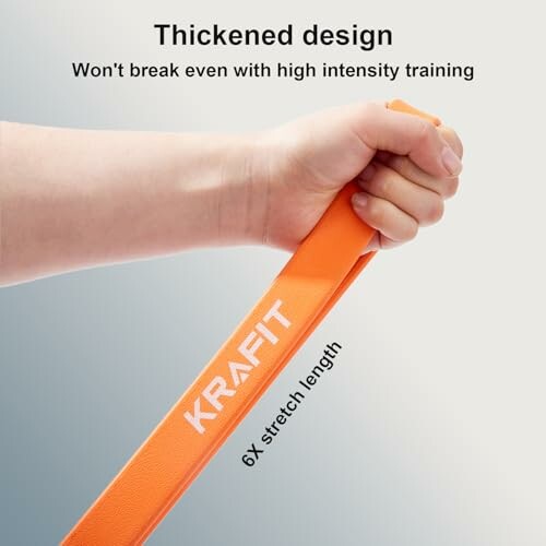 Hand hält orangefarbenes Widerstandsband